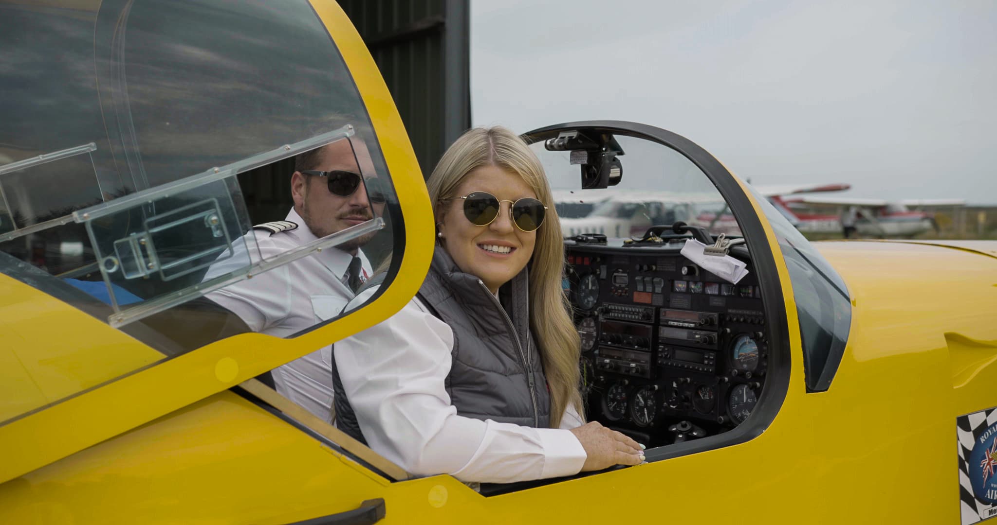 Two pilots in a yellow plane